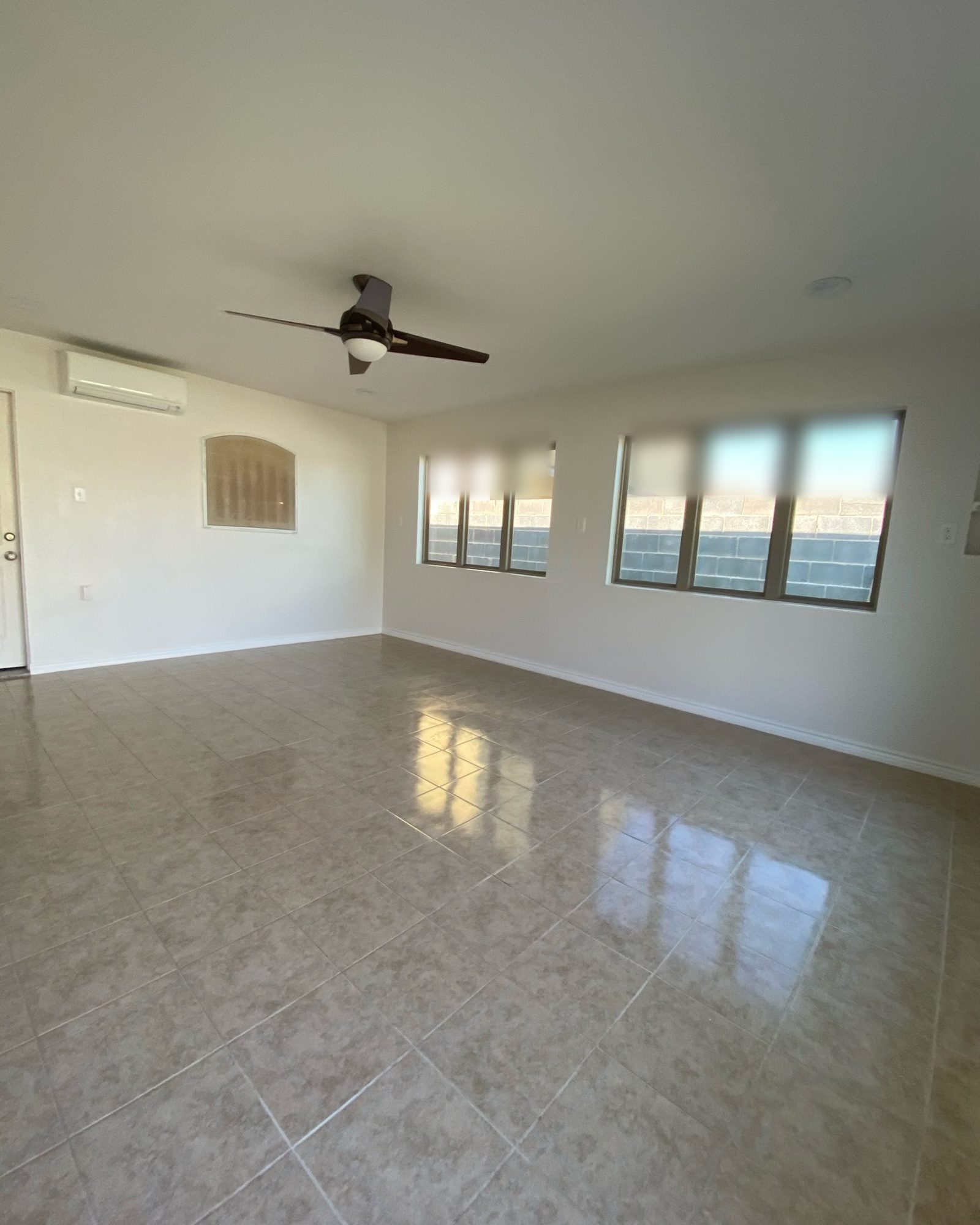 Tile floors, a ceiling fan and a mini-split A/C.
