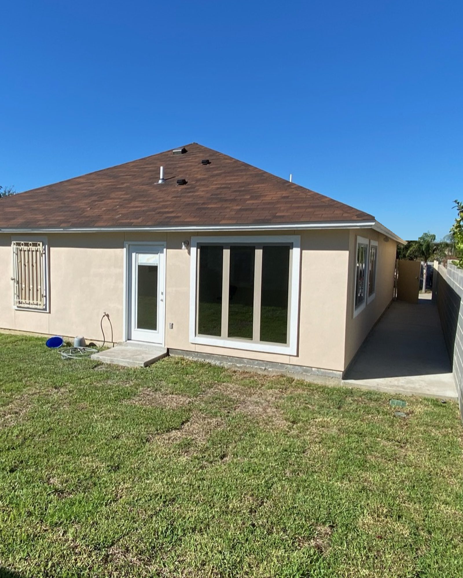 After: the finished addition with stucco to match the house